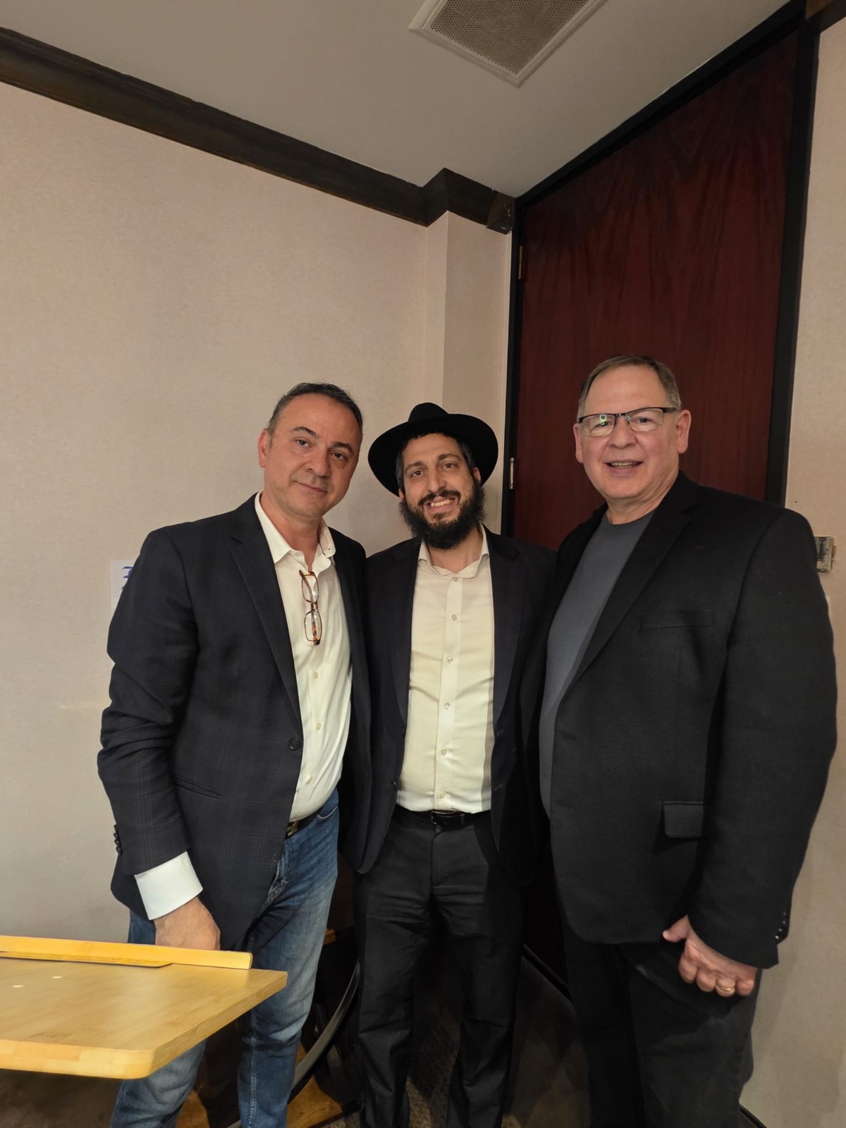 Elliot Bogod receiving his Israel Tribune Social Impact Award with Moe Rock, Ashkan Tabibnia, and Rabbi Danny
